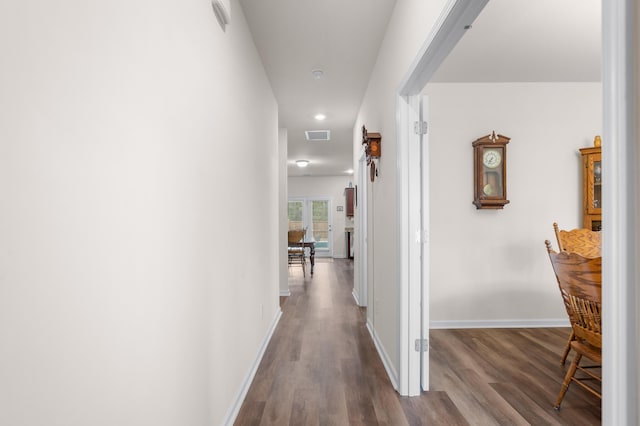 hallway featuring hardwood / wood-style floors and french doors