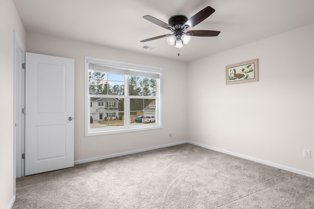 carpeted empty room with ceiling fan