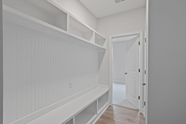 mudroom with visible vents and wood finished floors