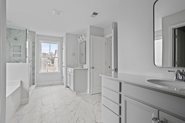 bathroom featuring visible vents, two vanities, a sink, a shower stall, and marble finish floor