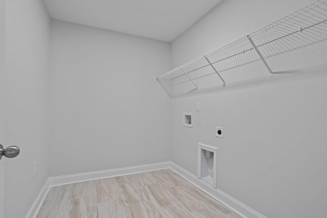 washroom with washer hookup, laundry area, baseboards, and hookup for an electric dryer