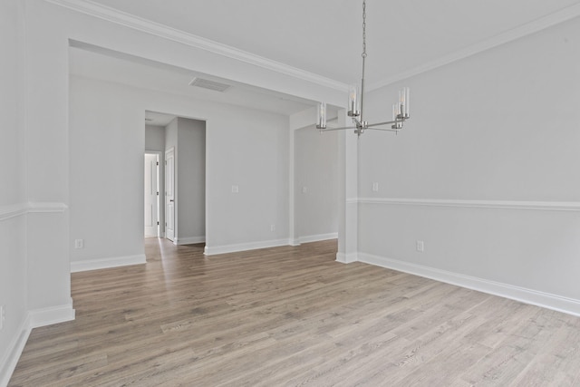 unfurnished dining area featuring light wood-style flooring, a notable chandelier, visible vents, and ornamental molding