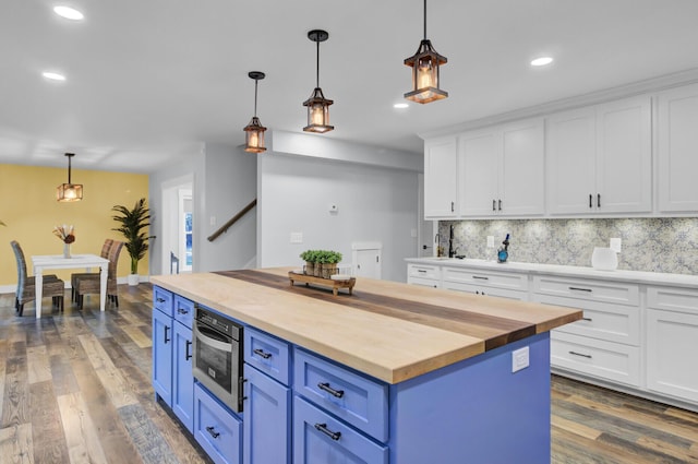 4429 Francis Younge Way, Hollywood, SC 29449 - kitchen with white cabinets, dark wood finished floors, decorative backsplash, butcher block counters, and blue cabinets