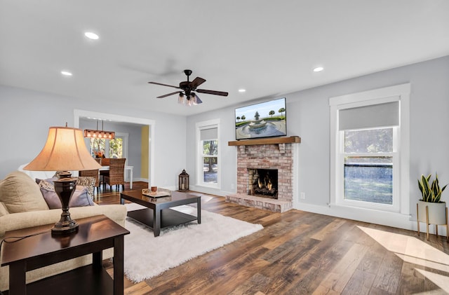 4429 Francis Younge Way, Hollywood, SC 29449 - living area with recessed lighting, ceiling fan with notable chandelier, wood finished floors, and a fireplace