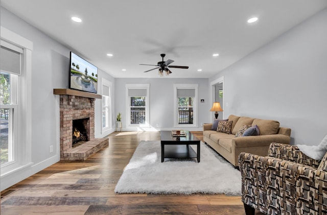 4429 Francis Younge Way, Hollywood, SC 29449 - living area featuring recessed lighting, a ceiling fan, a brick fireplace, and wood finished floors