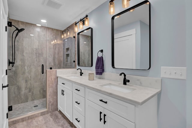 bathroom with vanity and an enclosed shower