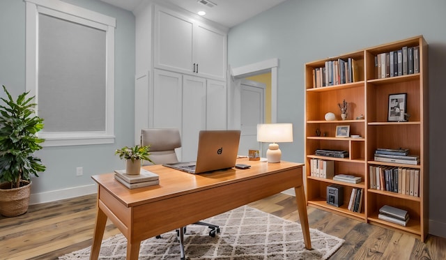 4429 Francis Younge Way, Hollywood, SC 29449 - home office with baseboards, wood finished floors, and visible vents