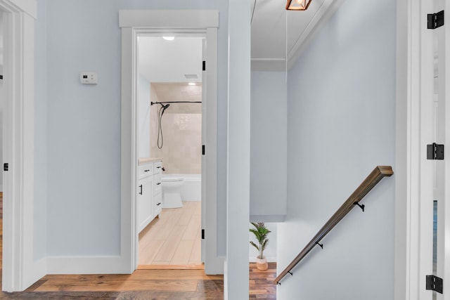 hallway with hardwood / wood-style flooring