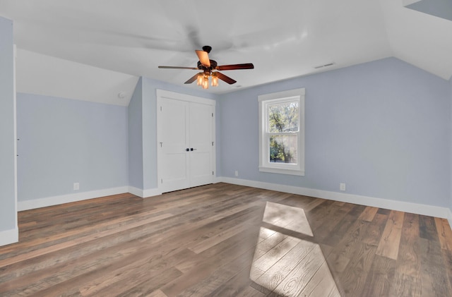 additional living space with ceiling fan, lofted ceiling, and hardwood / wood-style floors