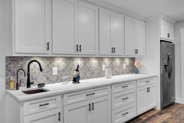 4429 Francis Younge Way, Hollywood, SC 29449 - kitchen with white cabinetry, decorative backsplash, a sink, and fridge with ice dispenser