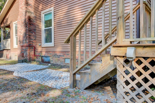 view of exterior entry with a patio