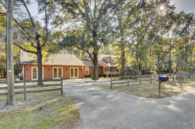 4429 Francis Younge Way, Hollywood, SC 29449 - view of front of property featuring french doors, fence, and driveway