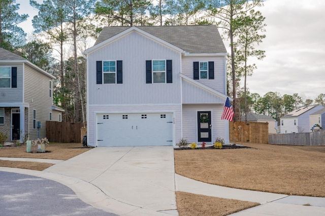 view of front of house featuring a front yard and a garage