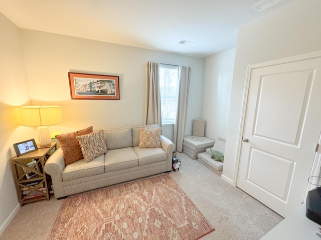 living room featuring light carpet