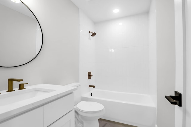 bathroom with shower / washtub combination, toilet, and vanity