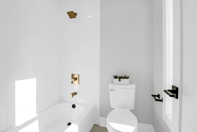 bathroom with toilet and shower / bathtub combination