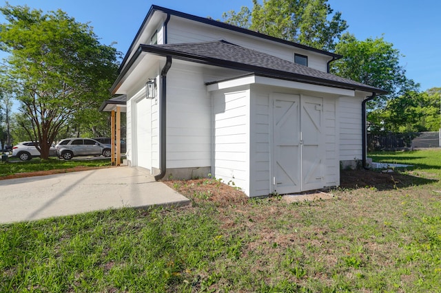 view of outbuilding with fence