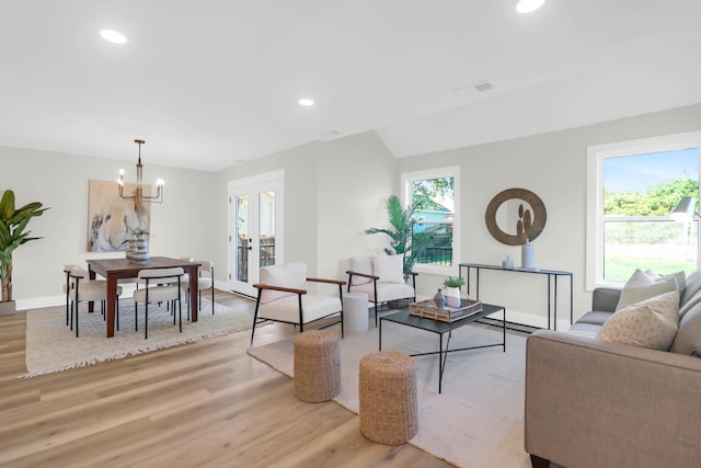 living area featuring a wealth of natural light and light wood-style floors