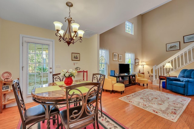 dining area featuring a notable chandelier and hardwood / wood-style floors