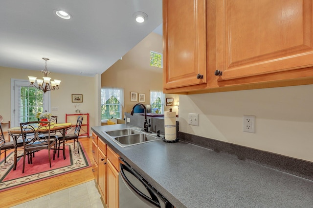 kitchen with decorative light fixtures, sink, black dishwasher, an inviting chandelier, and lofted ceiling