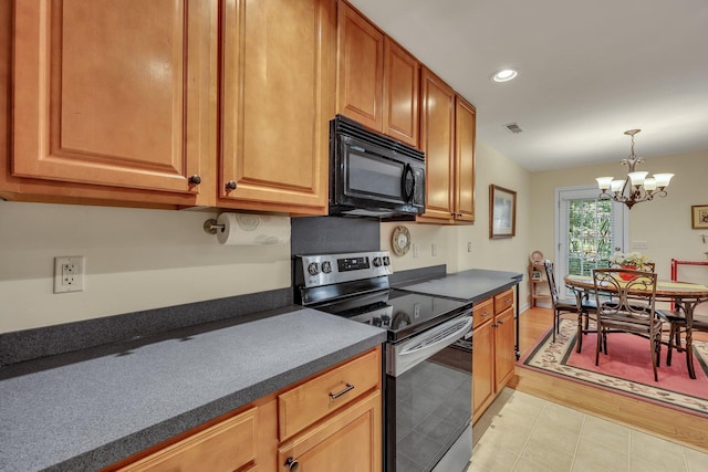 kitchen featuring pendant lighting, stainless steel range with electric cooktop, and an inviting chandelier