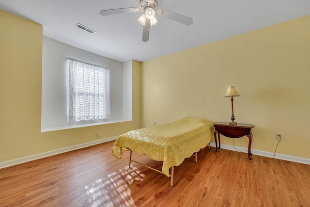 bedroom featuring ceiling fan and light hardwood / wood-style floors