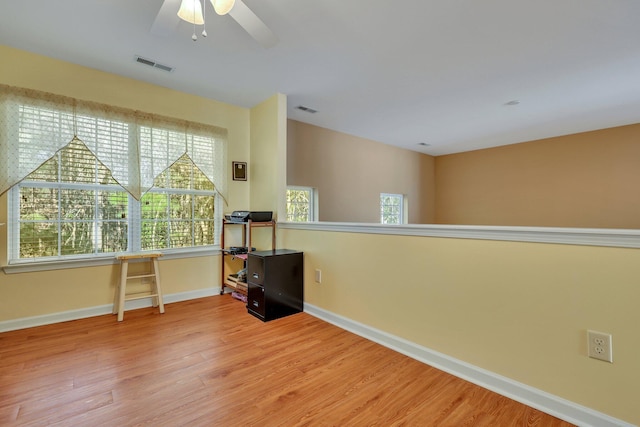 interior space featuring ceiling fan and hardwood / wood-style floors