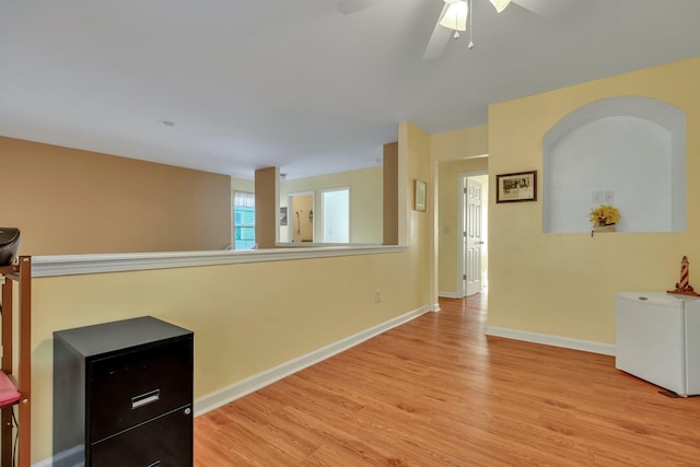 interior space featuring ceiling fan and light wood-type flooring