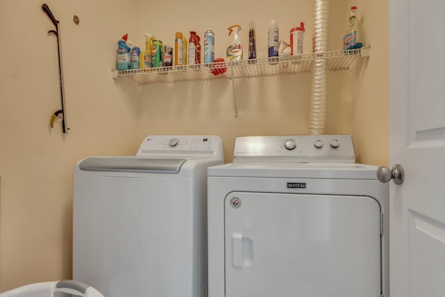 clothes washing area with washer and dryer