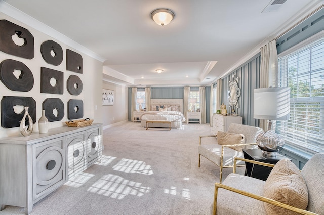 bedroom featuring carpet floors, a tray ceiling, visible vents, and multiple windows