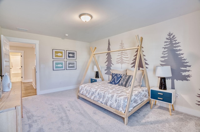 carpeted bedroom with baseboards