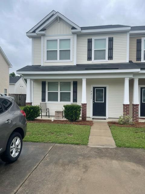 9217 Southern Oak Ln, Ladson, SC 29456 - craftsman house featuring a porch and brick siding