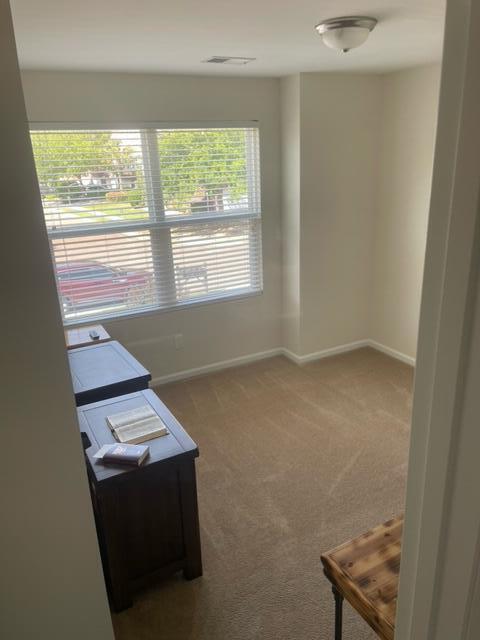 9217 Southern Oak Ln, Ladson, SC 29456 - carpeted spare room with baseboards