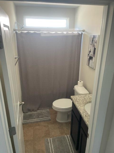 9217 Southern Oak Ln, Ladson, SC 29456 - full bath featuring vanity, curtained shower, and toilet