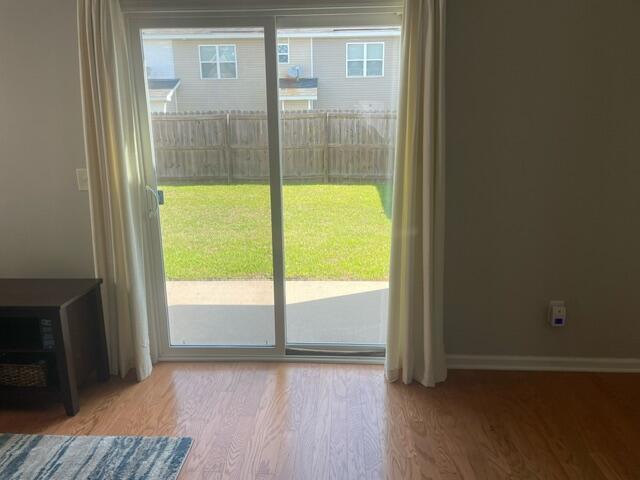 9217 Southern Oak Ln, Ladson, SC 29456 - doorway featuring wood finished floors and baseboards