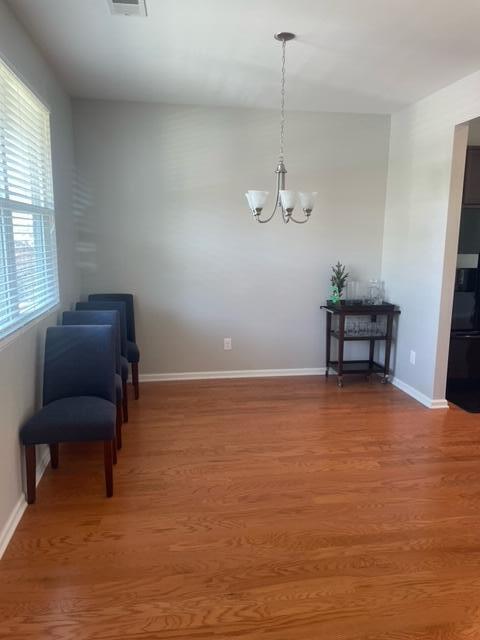 9217 Southern Oak Ln, Ladson, SC 29456 - sitting room featuring light wood-type flooring, a chandelier, and baseboards