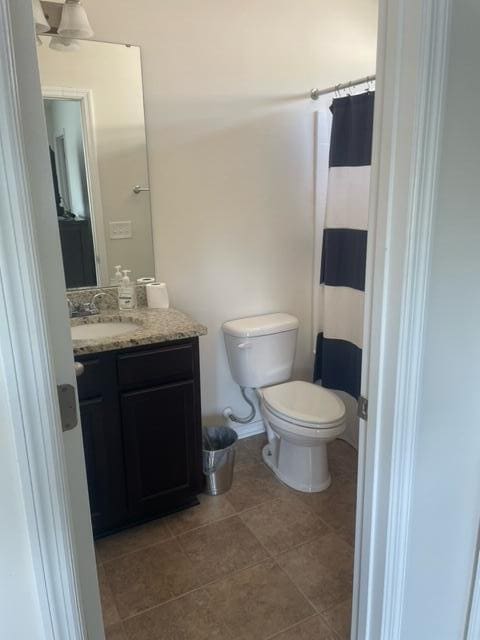9217 Southern Oak Ln, Ladson, SC 29456 - full bath featuring toilet, vanity, tile patterned floors, and a shower with shower curtain