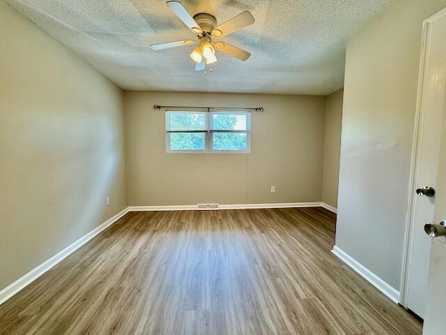 1820 Mepkin Rd Unit 1019, Charleston, SC 29407 - empty room featuring wood finished floors, a textured ceiling, and ceiling fan