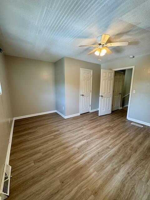 1820 Mepkin Rd Unit 1019, Charleston, SC 29407 - spare room featuring wood finished floors, a ceiling fan, and a textured ceiling