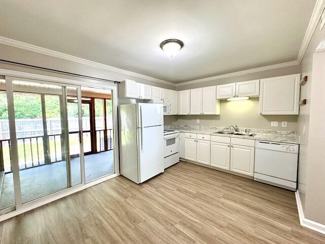 1820 Mepkin Rd Unit 1019, Charleston, SC 29407 - kitchen with white appliances, light wood-type flooring, light countertops, ornamental molding, and white cabinets