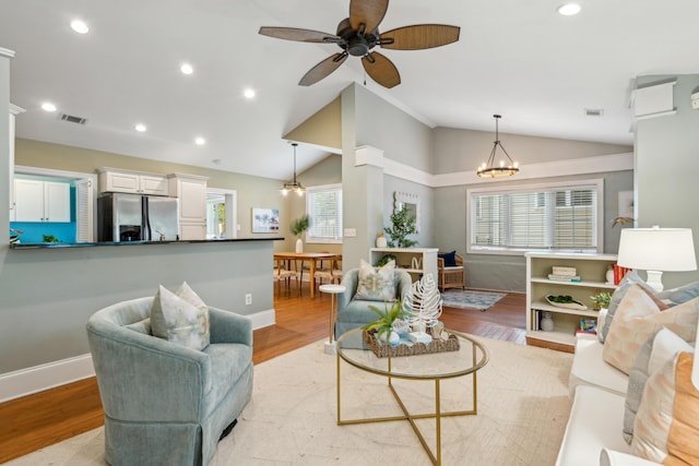 8 Tovey Rd, Charleston, SC 29407 - living area featuring vaulted ceiling, light wood-type flooring, recessed lighting, a ceiling fan, and a chandelier