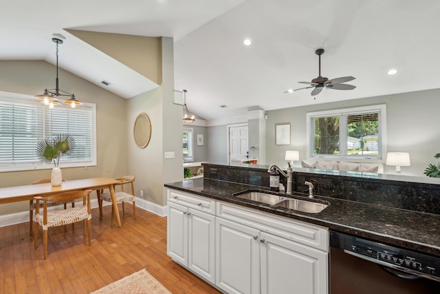 8 Tovey Rd, Charleston, SC 29407 - kitchen with black dishwasher, vaulted ceiling, ceiling fan, white cabinetry, and pendant lighting
