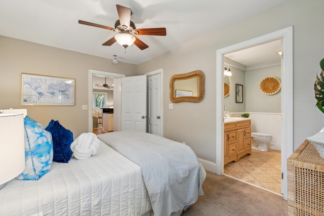 8 Tovey Rd, Charleston, SC 29407 - bedroom with connected bathroom, light carpet, ceiling fan, and light tile patterned floors