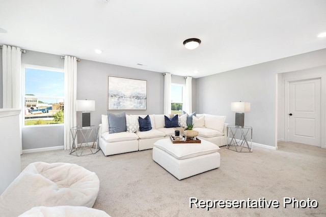 carpeted living room with plenty of natural light