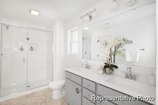 bathroom with vanity, an enclosed shower, and toilet