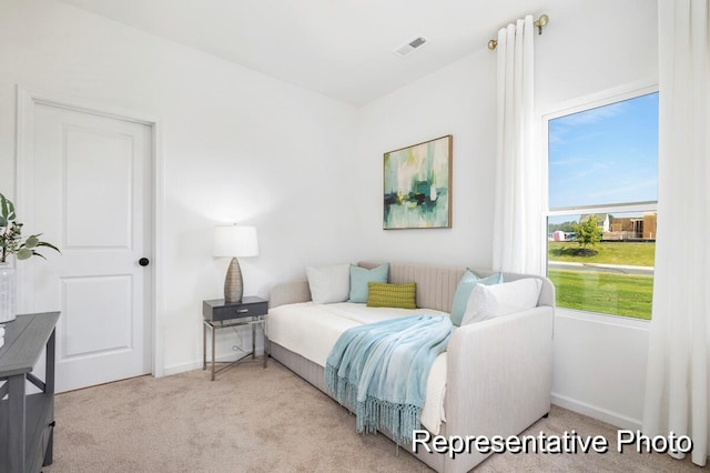 bedroom with light carpet