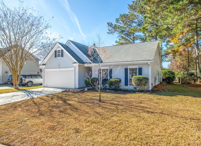 view of front of house with a garage and a front yard