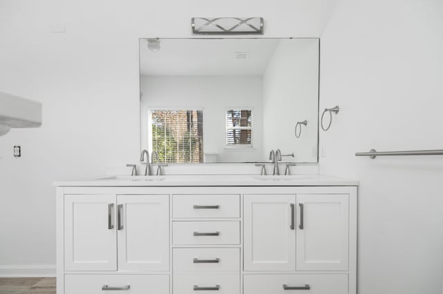 bathroom featuring vanity and hardwood / wood-style flooring