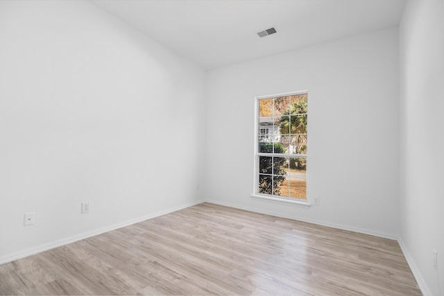 spare room featuring light hardwood / wood-style flooring