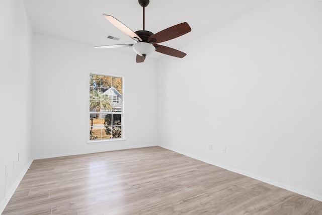 unfurnished room featuring ceiling fan, light wood-type flooring, and lofted ceiling